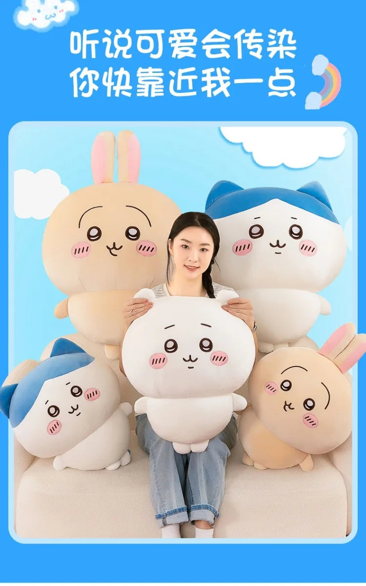 A woman is holding several soft plush dolls of Chiikawa characters, including Hachiware and Usagi.