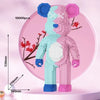 A pink and blue large bear building block model displayed against a pink background with size measurements.