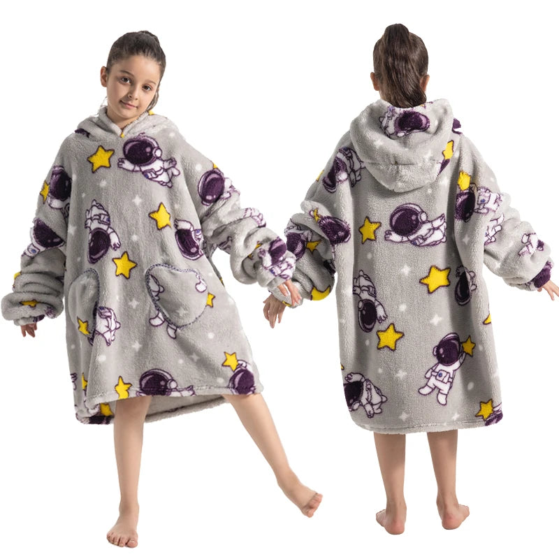 A girl models a gray and purple patterned cozy kids flannel hoodie sweater for winter.