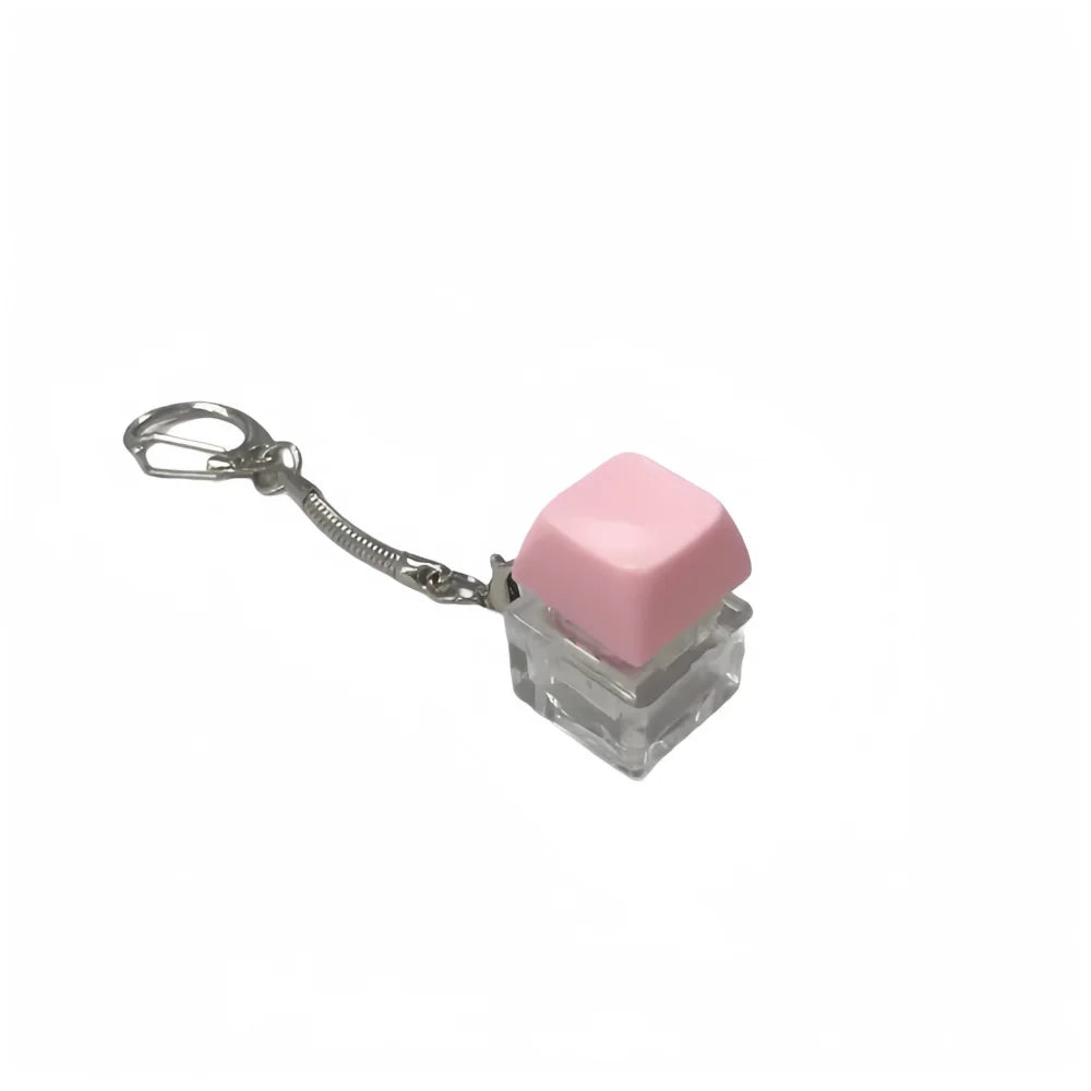 A pink, translucent cube fidget toy attached to a silver keychain.