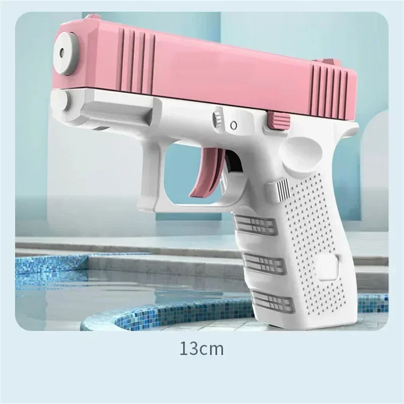A pink and white high-pressure water blaster toy gun is shown resting on a tiled surface.