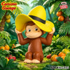 A collectible figure of Curious George in a yellow hat sitting in a lush green jungle environment.