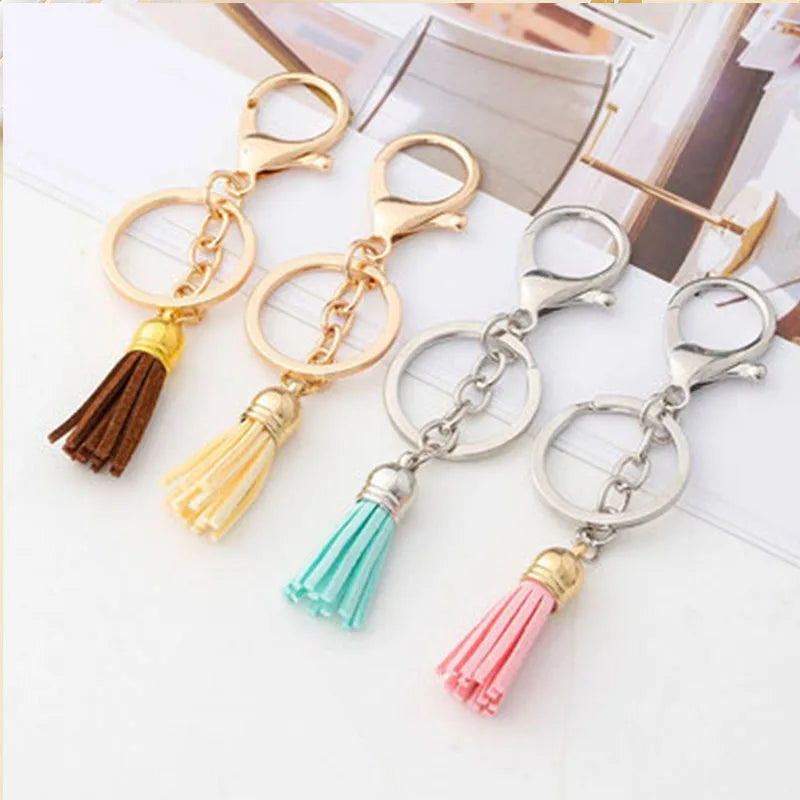 Four gold and silver chain necklaces with mixed color velvet tassels for DIY jewelry