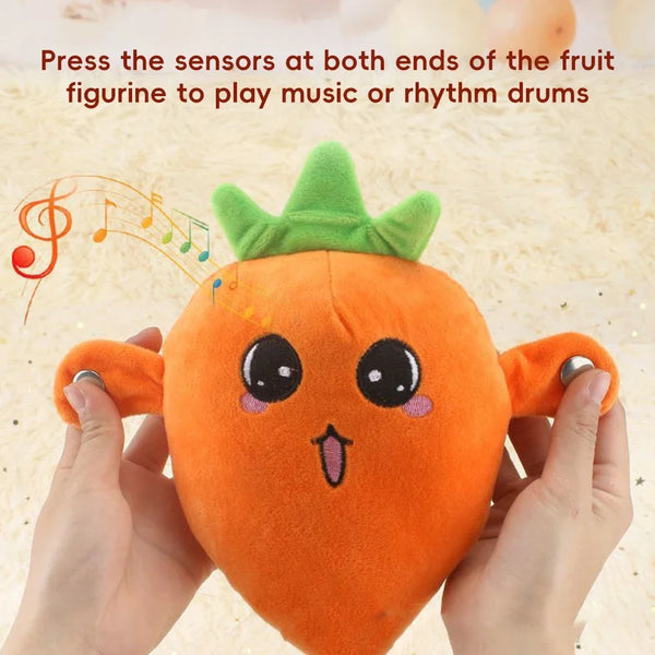 Hands hold an orange fruit figurine with sensors at both ends, ready to play music or rhythm drums.