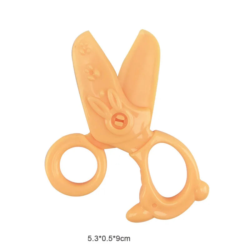 An orange play dough tool kit for kids featuring extruders, cutters, and rollers.