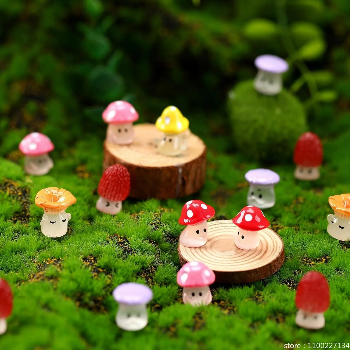 A collection of glow-in-the-dark resin miniature mushrooms in various colors resting on green moss.