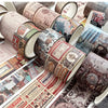 A collection of vintage patterned washi tape rolls in various colors and designs for crafting.