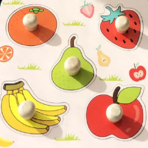 A wooden puzzle board featuring various fruit shapes like strawberries, apples, pears, and bananas.