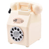 A vintage rotary telephone piggy bank in a pale beige color with a slot for coins and bills.