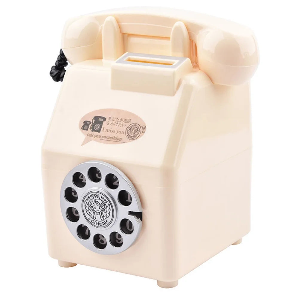 A vintage rotary telephone piggy bank in a pale beige color with a slot for coins and bills.