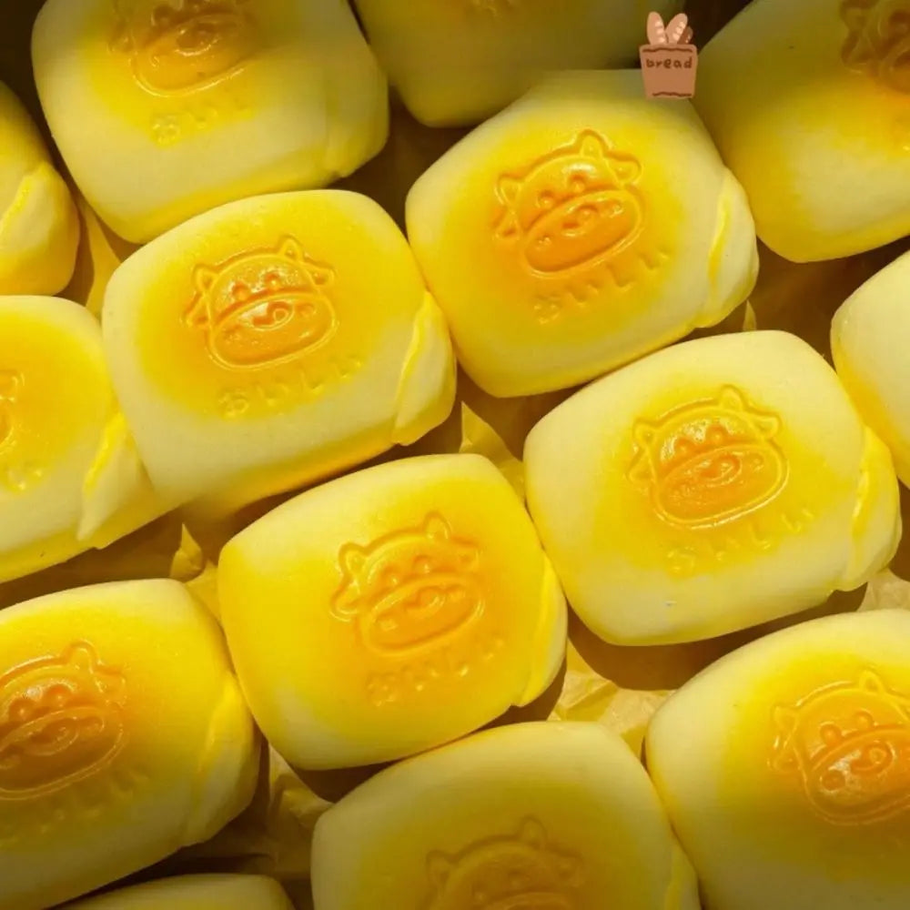 A collection of yellow squishy milk bread stress relief toys