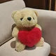 A fluffy teddy bear with a red heart attached to its chest.