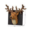 A building block set depicting a brown shark head with antlers mounted on a black background.