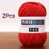 Two skeins of red yarn labeled as Yangbao Bao for crochet and knitting projects