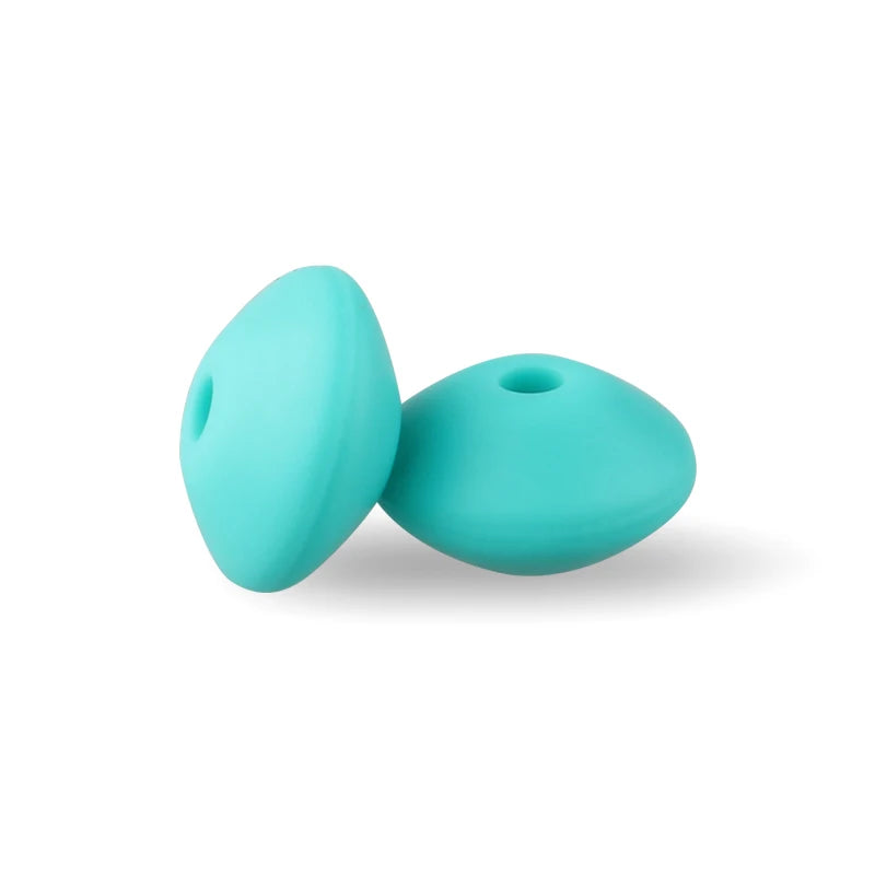 Two smooth, teal silicone lentil beads shaped like an abacus for jewelry making.