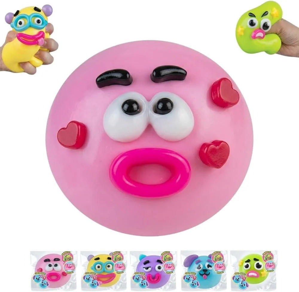 A pink squishy toy shaped like a dog face with various facial expressions and features.