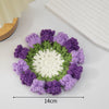 Hand-crocheted lily of the valley coasters featuring purple and green yarn petals