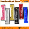 A set of colorful C key harmonicas for beginners with stainless steel covers displayed on a white background.