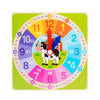 A colorful wooden clock face with numbers and shapes, featuring a cow and an arrow pointer for early learning.