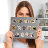 A woman holds up a pack of kawaii cat and animal stickers for laptops and scrapbooks