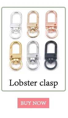 A collection of ten metal lobster clasps in various finishes including silver, gold, and black.