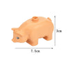 An orange plastic pig-shaped building block with dimensions 7.5cm by 3cm.