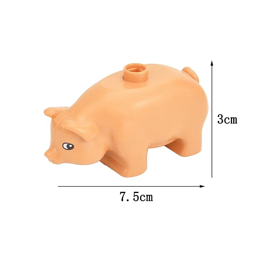 An orange plastic pig-shaped building block with dimensions 7.5cm by 3cm.