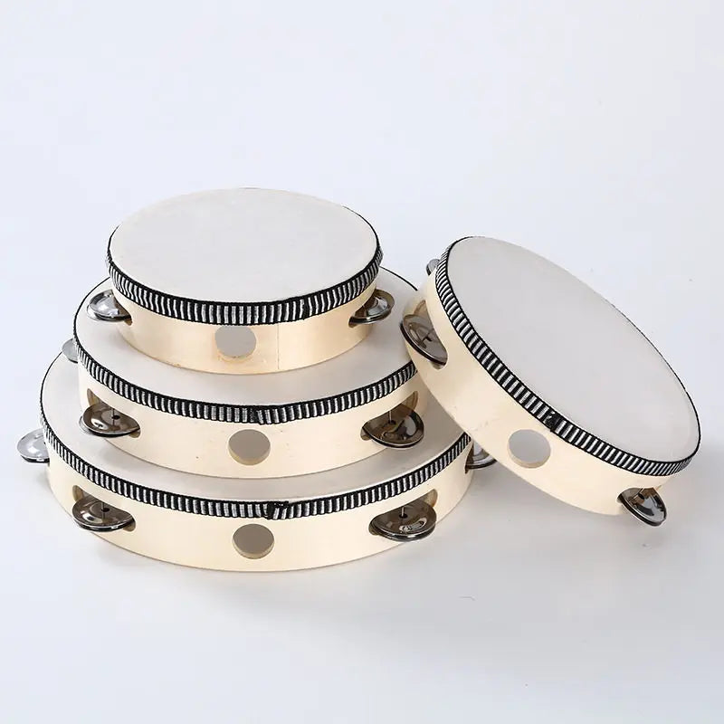 A round wooden tambourine with metal jingles, shown from the top view.