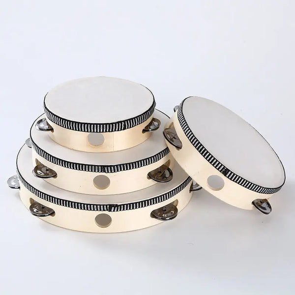 A round wooden tambourine with metal jingles, shown from the top view.