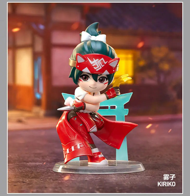 A collectible PVC figurine of a female character in Overwatch attire with red and white hair and armor.