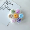 A silicone mold set featuring various pastel colored 3D flowers for crafting and baking.