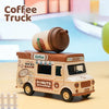 A miniature coffee truck toy featuring a brown milk carton and a sign for coffee and donuts.
