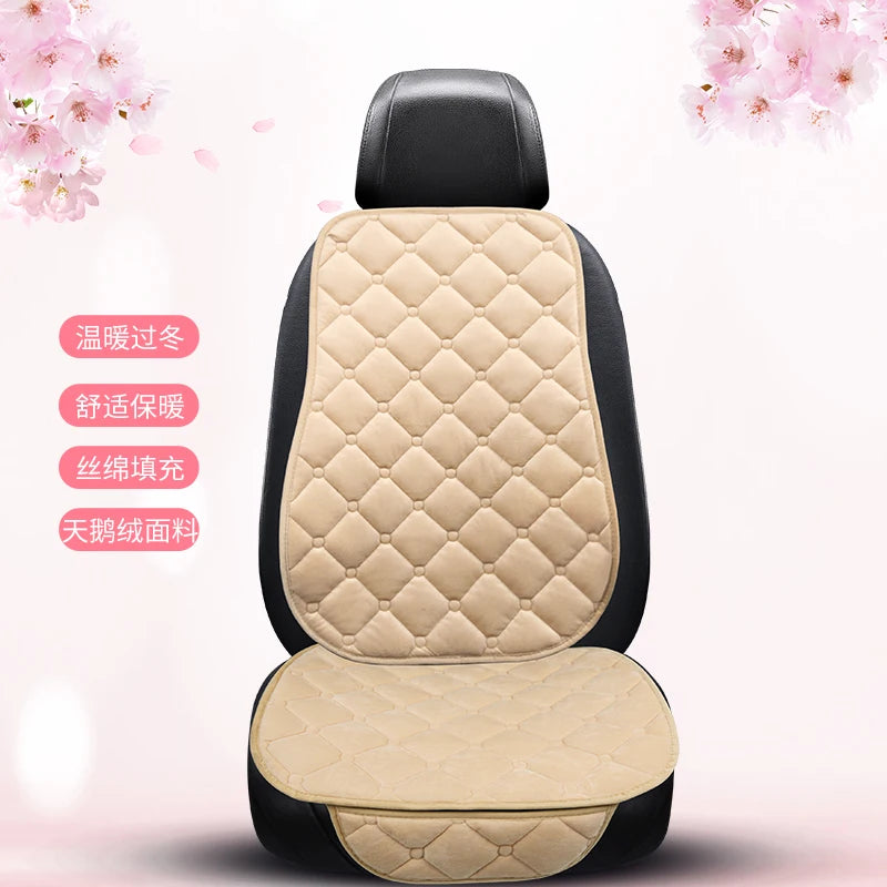 A beige quilted car seat cushion set with black trim shown from the back, highlighting features like warmth and anti-slip mat