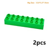 Plateau de construction en plastique vert avec 12 pièces à emboîter, vendu en paire.