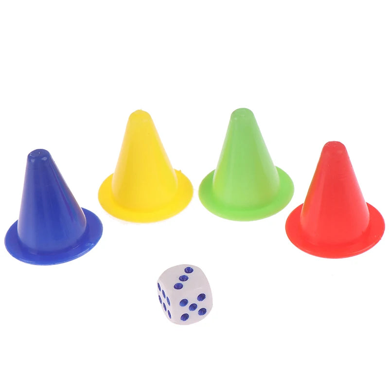 A set of five plastic game pieces including colored pyramids and a blue and white dice for a Snakes and Ladders board game