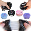 Various black and purple biscuit squishy stress relief toys and fidget items are shown being held by hands.
