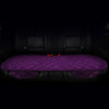 A purple quilted car seat cushion set with black leather upholstery shown in a vehicle interior.