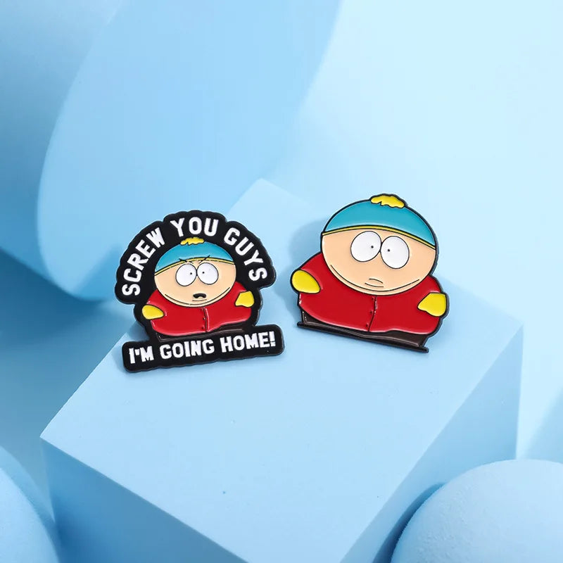 A set of enamel pins featuring a cartoon character saying I'm going home, displayed on a light blue surface.