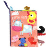 A pink cloth book featuring farm animals like a cow, pig, and lion, designed for sensory play.