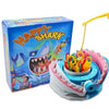 A box of Happy Shark prank board game with a colorful shark design and components.