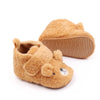 A pair of cute bear design baby prewalker shoes with a soft anti-slip sole.