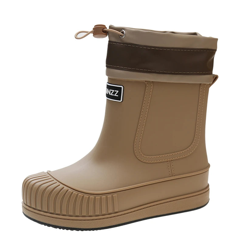A tan waterproof mid-calf rain boot with a brown cuff and a beige sole.