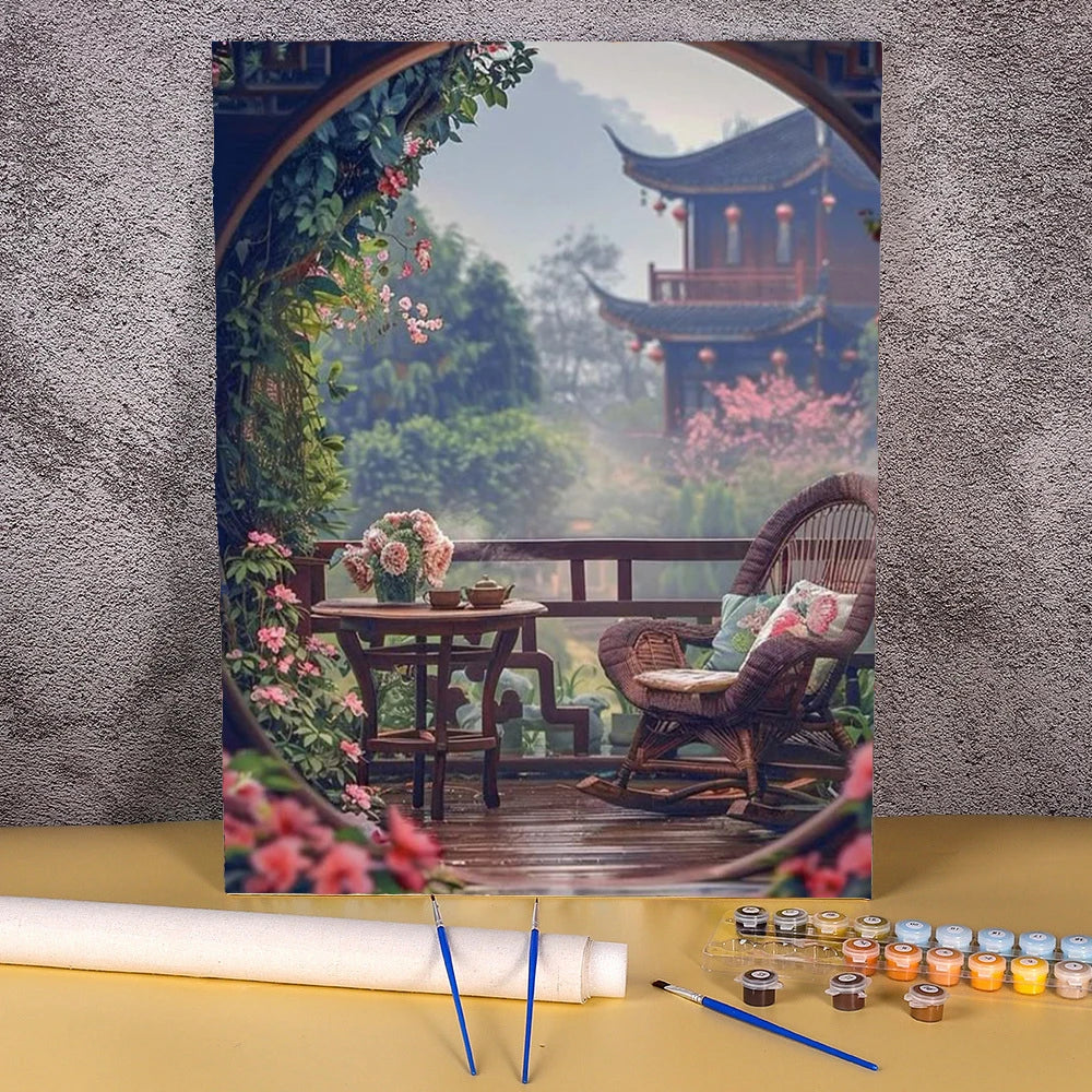 A paint by numbers kit featuring a flower field and wooden house landscape painting on canvas.