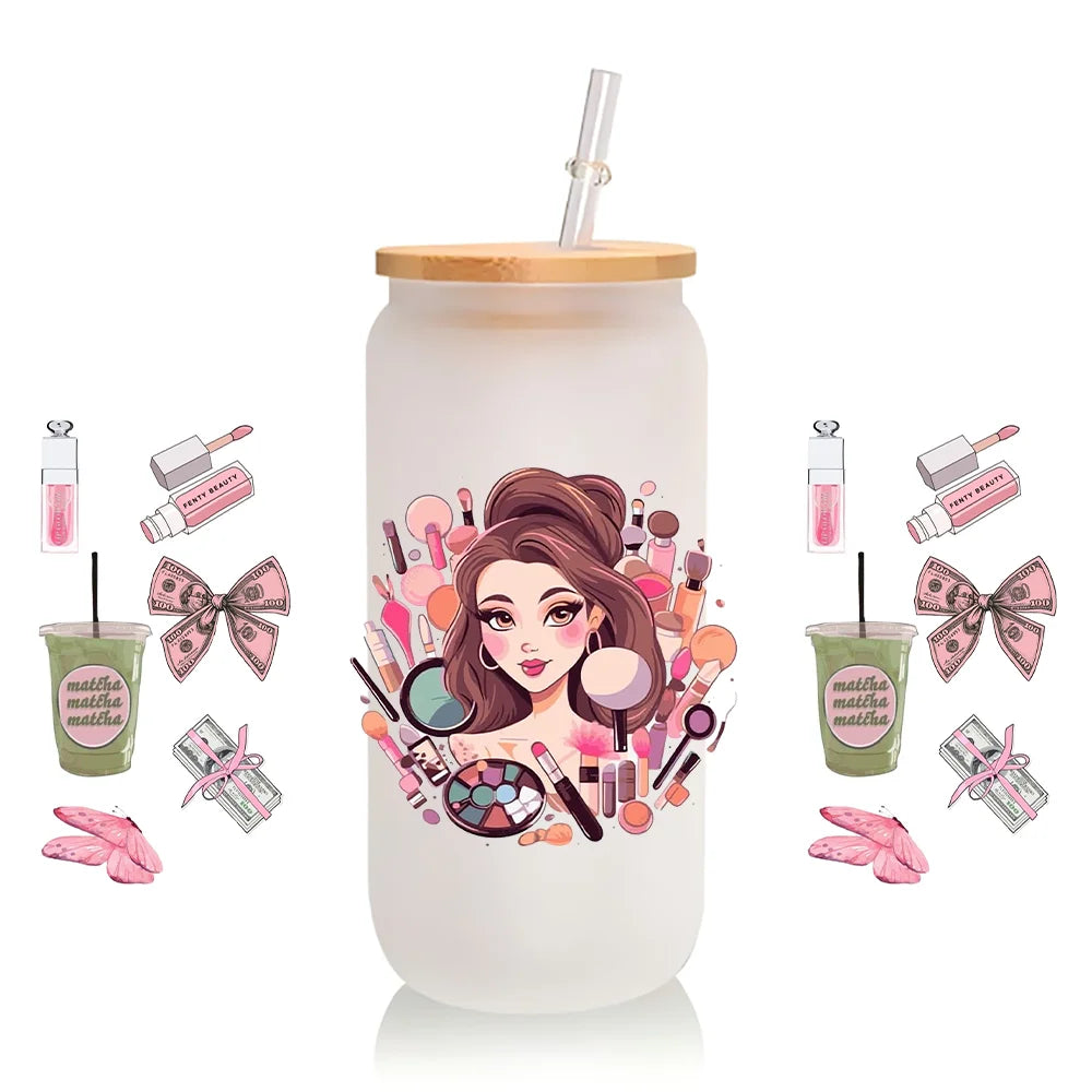 A white tumbler with a pink and gold makeup theme featuring illustrations of various cosmetic products and a woman's portrait