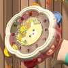 A pink and white musical instrument set featuring a hand drum and shake rattle for toddlers.