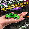 A bright green 1:64 scale model drift car is held in a person's hand against a checkered background.