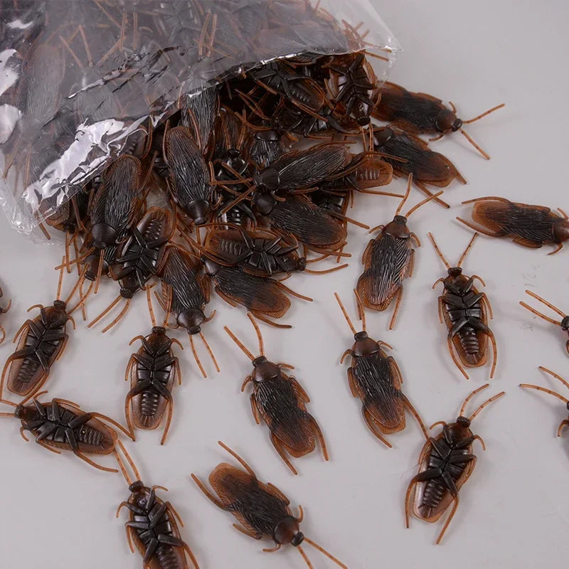 A pile of dark brown, lifelike fake cockroaches for props and Halloween