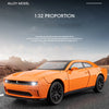 Orange diecast model car of a Dodge Challenger SRT Hellcat in 1:32 proportion driving on an asphalt road.