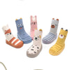 A collection of cute cartoon animal non-slip socks in various colors and patterns for babies and toddlers.