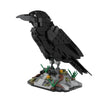 A black bird model built from building blocks, standing on a gray base.